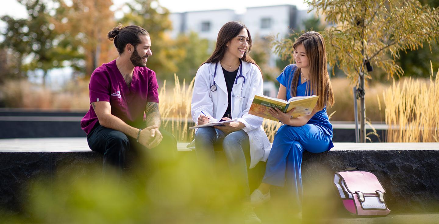 Health Profession students studying outside.